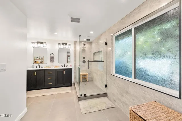 a bathroom with a tub shower and sink