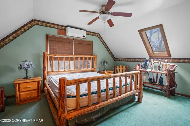 a bedroom with furniture and a window