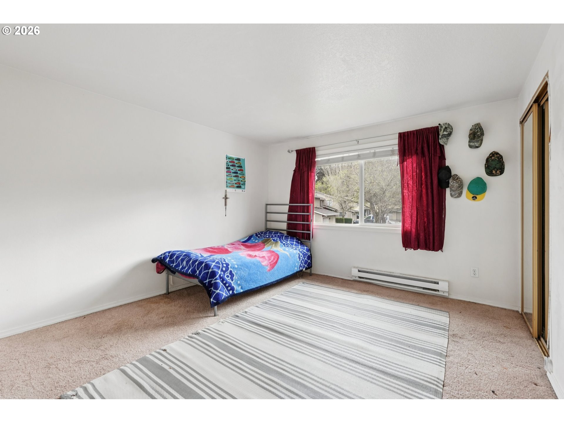 29480 Southwest Volley Street Wilsonville, OR 97070 - Photo 15 of 29 a bedroom with a bed and window