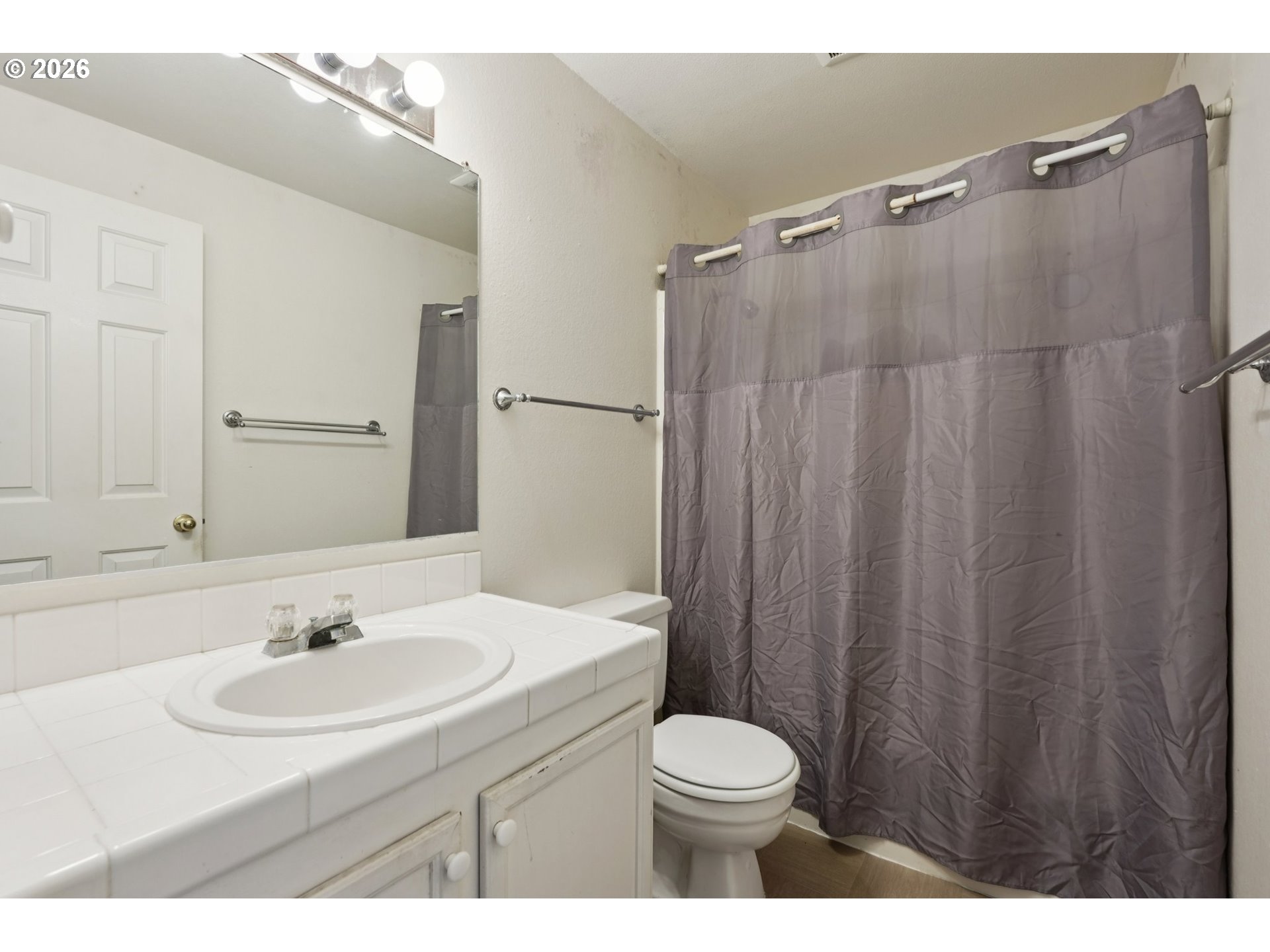29480 Southwest Volley Street Wilsonville, OR 97070 - Photo 20 of 29 a bathroom with a sink a toilet a mirror and shower