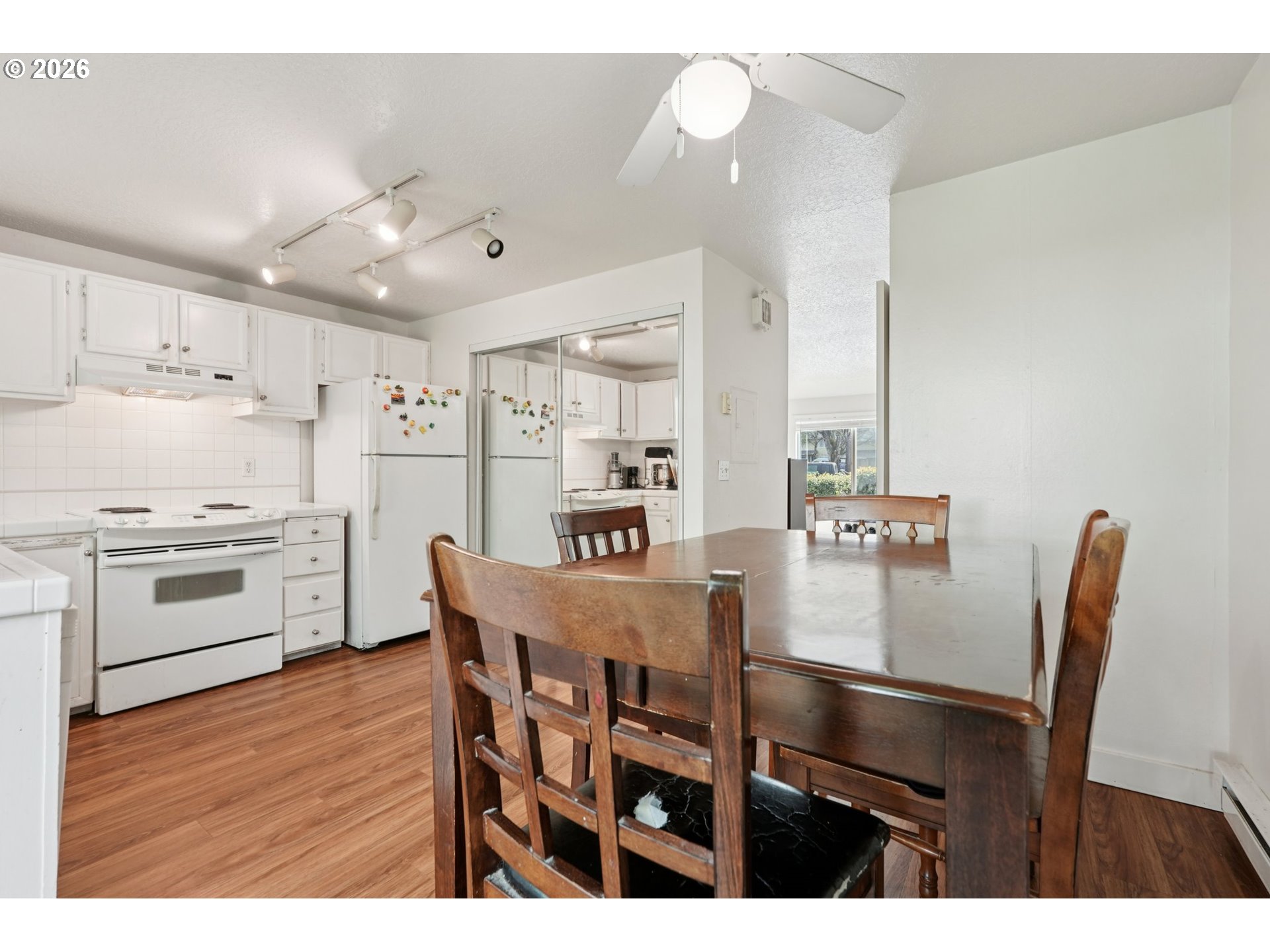 29480 Southwest Volley Street Wilsonville, OR 97070 - Photo 9 of 29 a view of kitchen with cabinets table and chairs