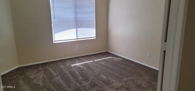 a bathroom with a toilet and shower