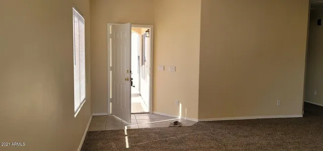 a view of an empty room and window