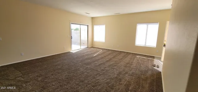 a view of an empty room and window
