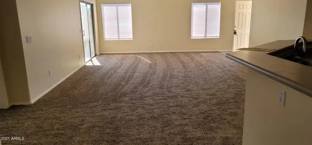 a view of a kitchen with a sink cabinets and a window