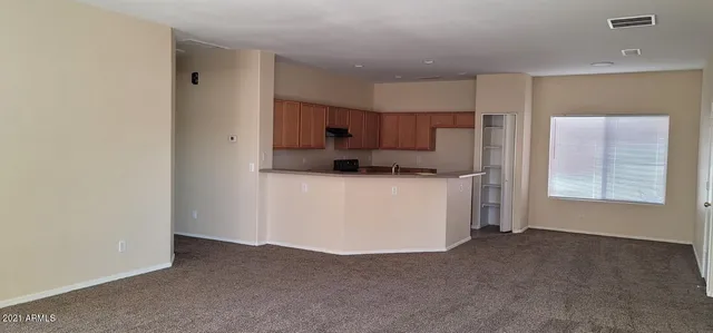 a kitchen with granite countertop a stove and a sink