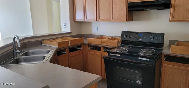 a kitchen with a stove and a sink