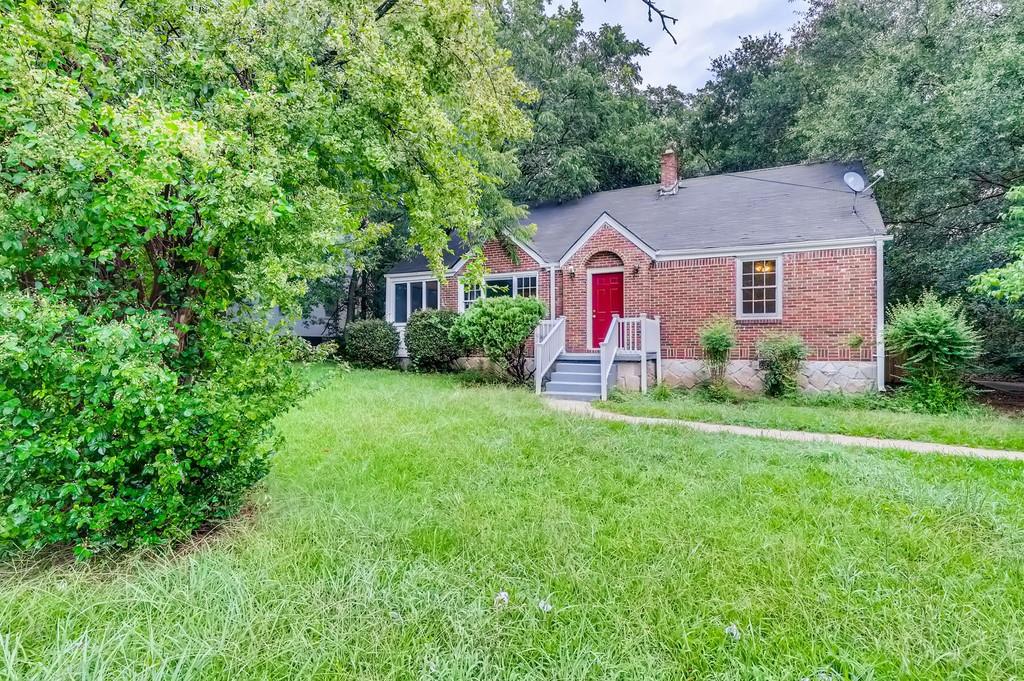 1964 2nd Avenue Decatur, GA 30032 - Photo 1 of 1 a view of a yard in front of a house with large trees