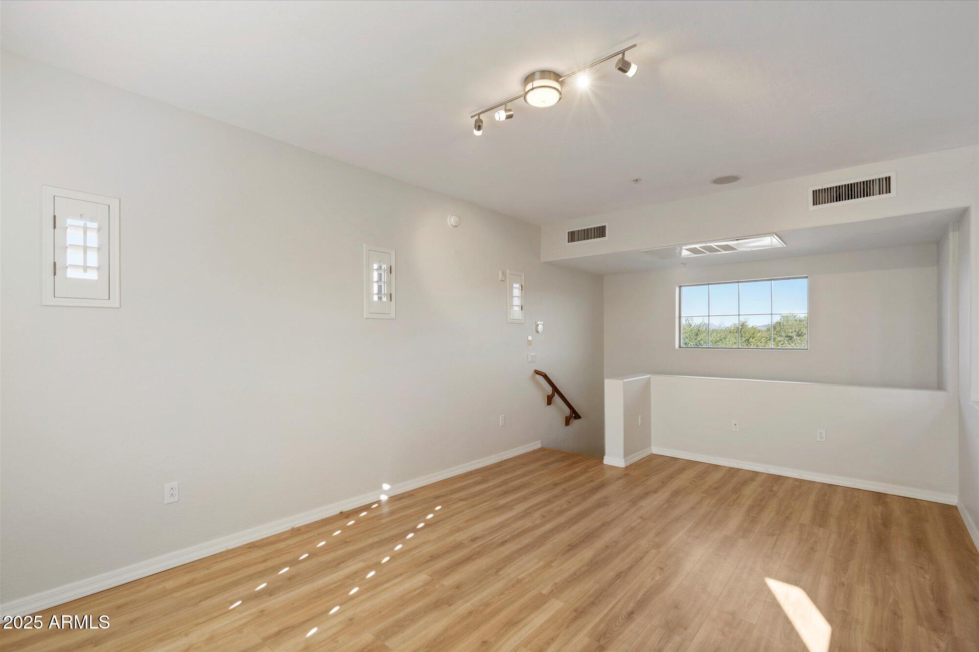 3935 East Rough Rider Road, Unit 1034 Phoenix, AZ 85050 - Photo 14 of 22 a view of a room with a empty space