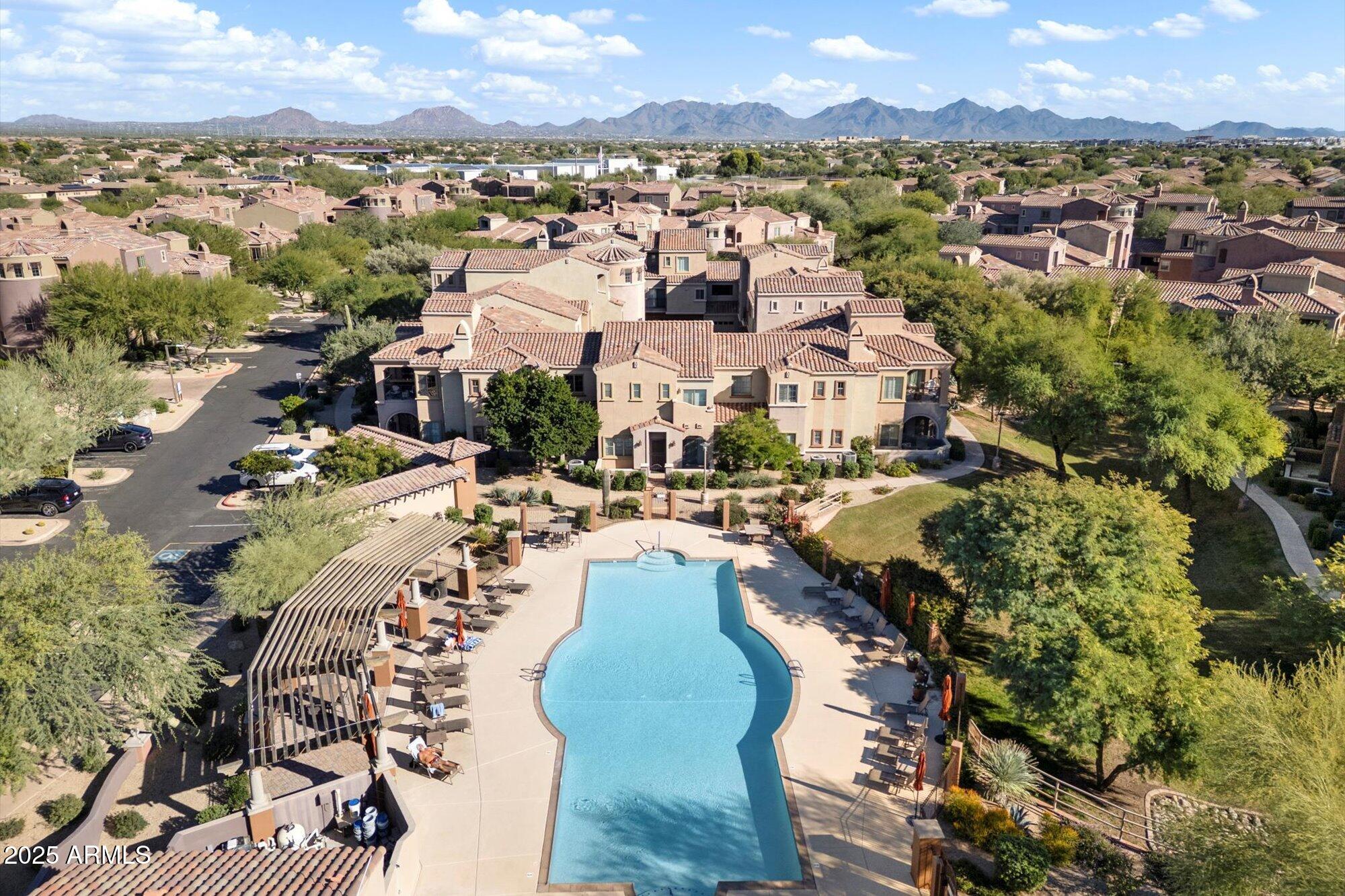 3935 East Rough Rider Road, Unit 1034 Phoenix, AZ 85050 - Photo 20 of 22 an aerial view of a city with lots of residential buildings