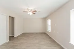 a view of an empty room with a window