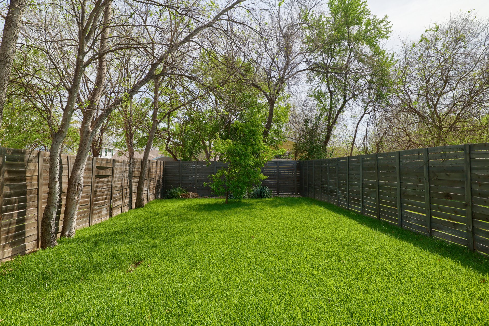 1103 Saucedo Street, Unit B Austin, TX 78721 - Photo 26 of 26 The thoughtful landscaping and fencing ensure this yard serves as a quiet getaway from the pace of daily life