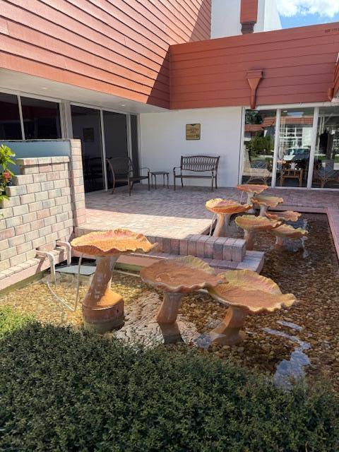 2600 Southeast Ocean Boulevard, Unit JJ2 Stuart, FL 34996 - Photo 18 of 29 a view of a house with backyard and sitting area