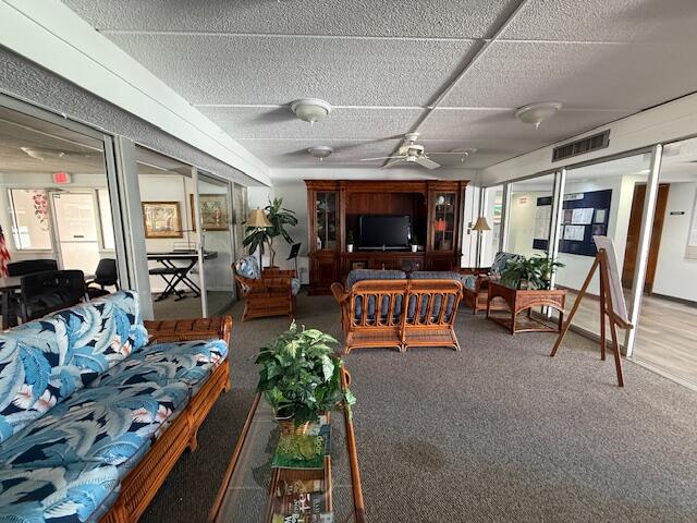 2600 Southeast Ocean Boulevard, Unit JJ2 Stuart, FL 34996 - Photo 20 of 29 a living room with furniture and a flat screen tv