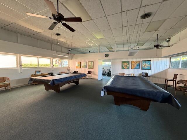 2600 Southeast Ocean Boulevard, Unit JJ2 Stuart, FL 34996 - Photo 21 of 29 a living room with lots of furniture and a chandelier