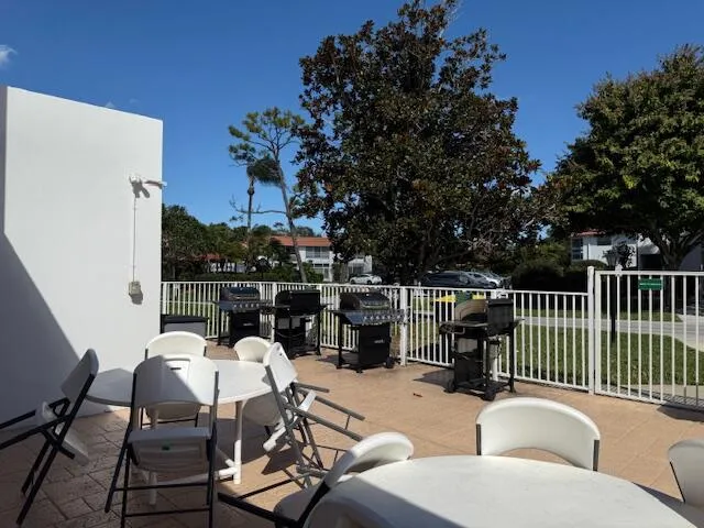 a balcony view with a seating space