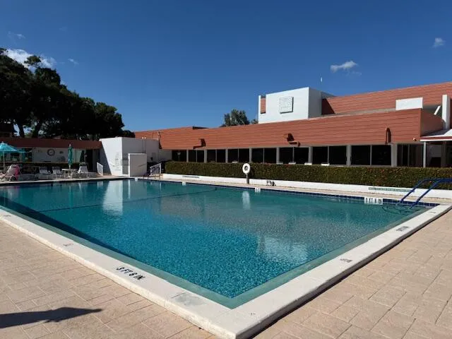 a view of swimming pool with outdoor seating
