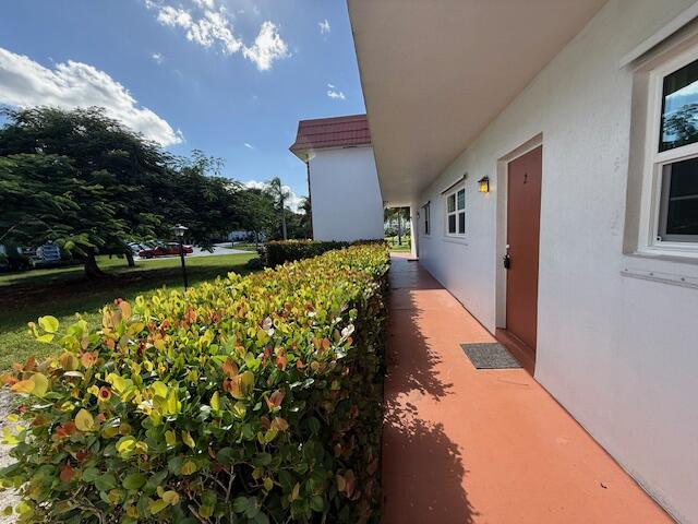 2600 Southeast Ocean Boulevard, Unit JJ2 Stuart, FL 34996 - Photo 3 of 29 a view of a house with a yard and fountain in middle of the house