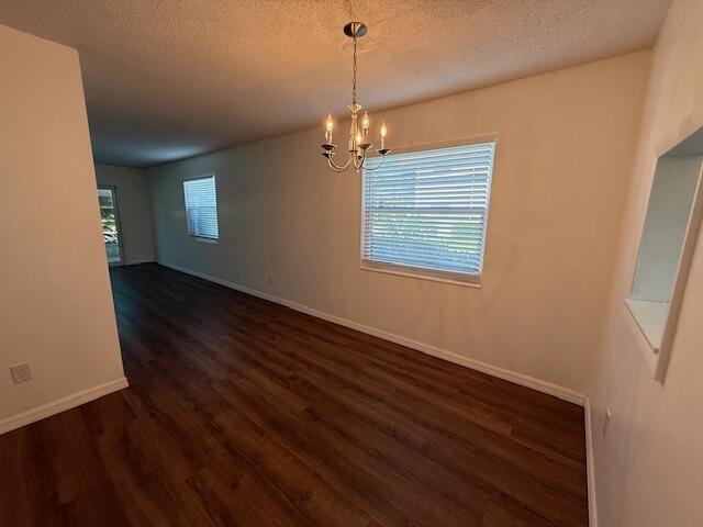 2600 Southeast Ocean Boulevard, Unit JJ2 Stuart, FL 34996 - Photo 4 of 29 an empty room with wooden floor windows and entrance