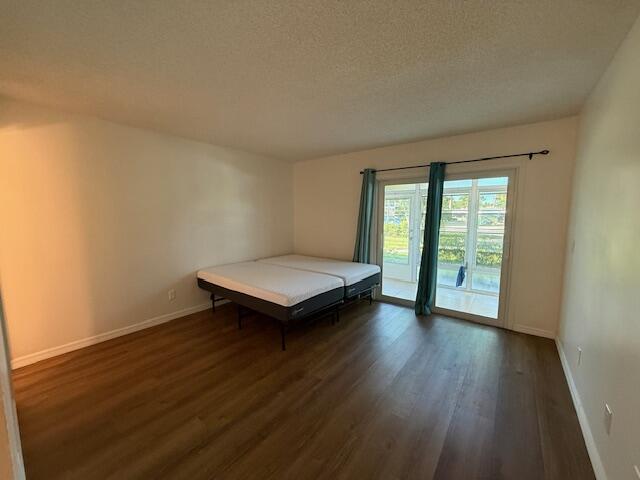 2600 Southeast Ocean Boulevard, Unit JJ2 Stuart, FL 34996 - Photo 8 of 29 wooden floor in an empty room with a window