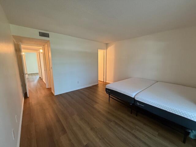 2600 Southeast Ocean Boulevard, Unit JJ2 Stuart, FL 34996 - Photo 9 of 29 a room with wooden floor and window