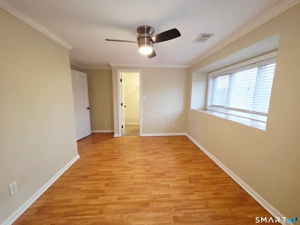 a view of an empty room with a window