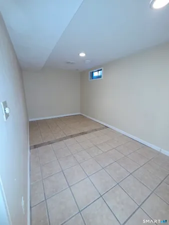 a view of an empty room and a window