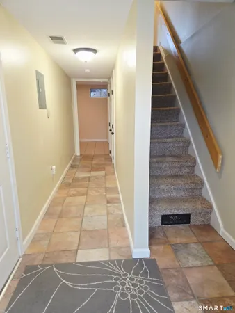 a view of entryway with wooden floor