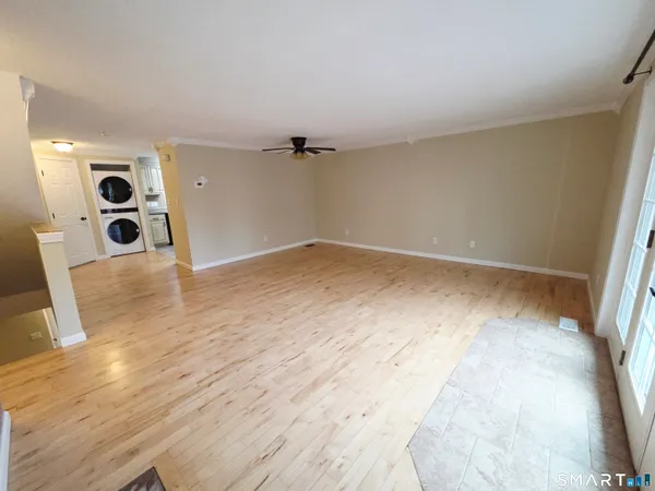 an empty room with wooden floor