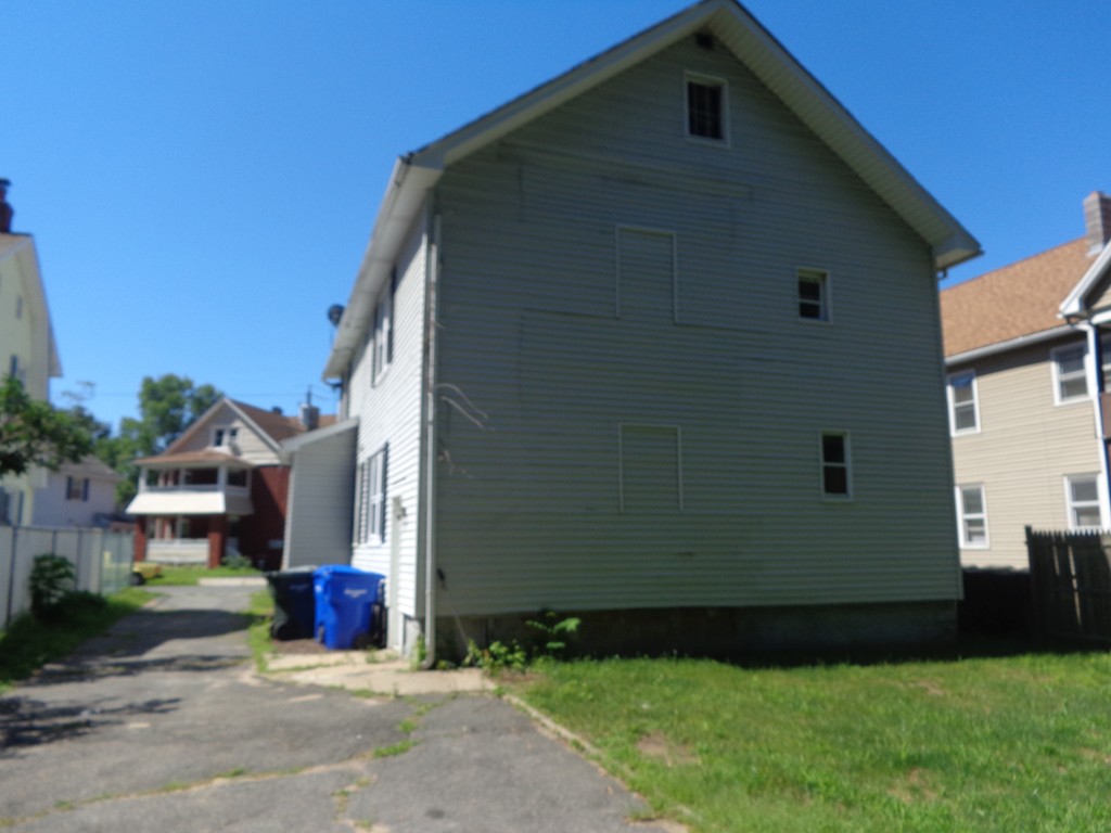 39-41 Ralph Street Springfield, MA 01109 - Photo 13 of 13 a front view of a house with garden