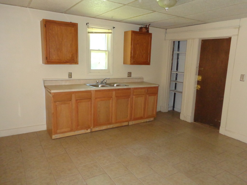 39-41 Ralph Street Springfield, MA 01109 - Photo 2 of 13 a bathroom with a tub sink and mirror