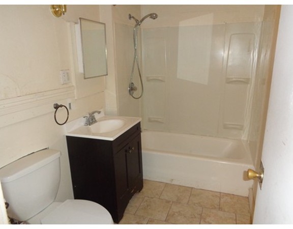 39-41 Ralph Street Springfield, MA 01109 - Photo 6 of 13 a bathroom with a sink toilet vanity and shower