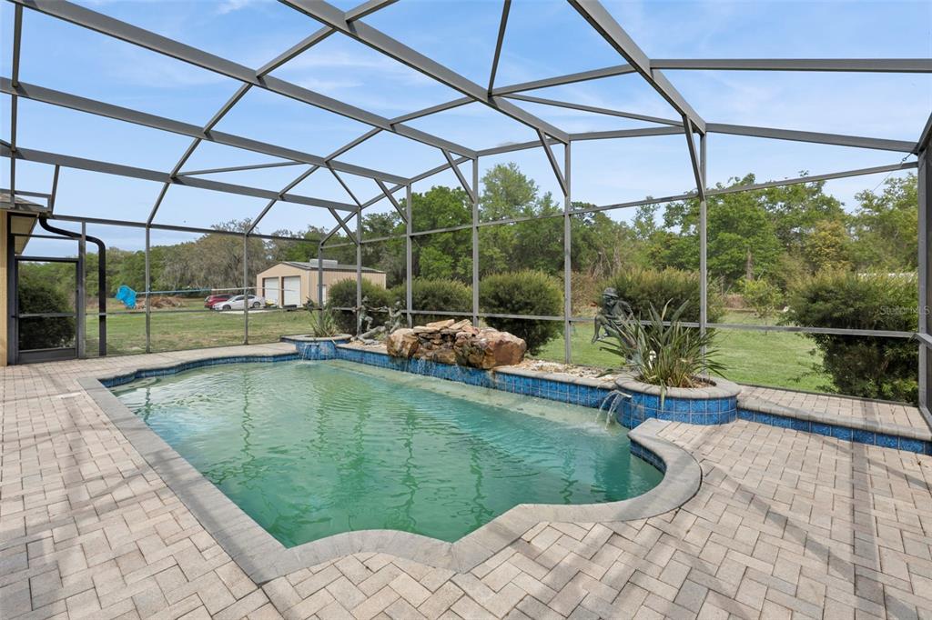 7139 Groveland Farms Road Groveland, FL 34736 - Photo 27 of 36 a view of a swimming pool with a patio