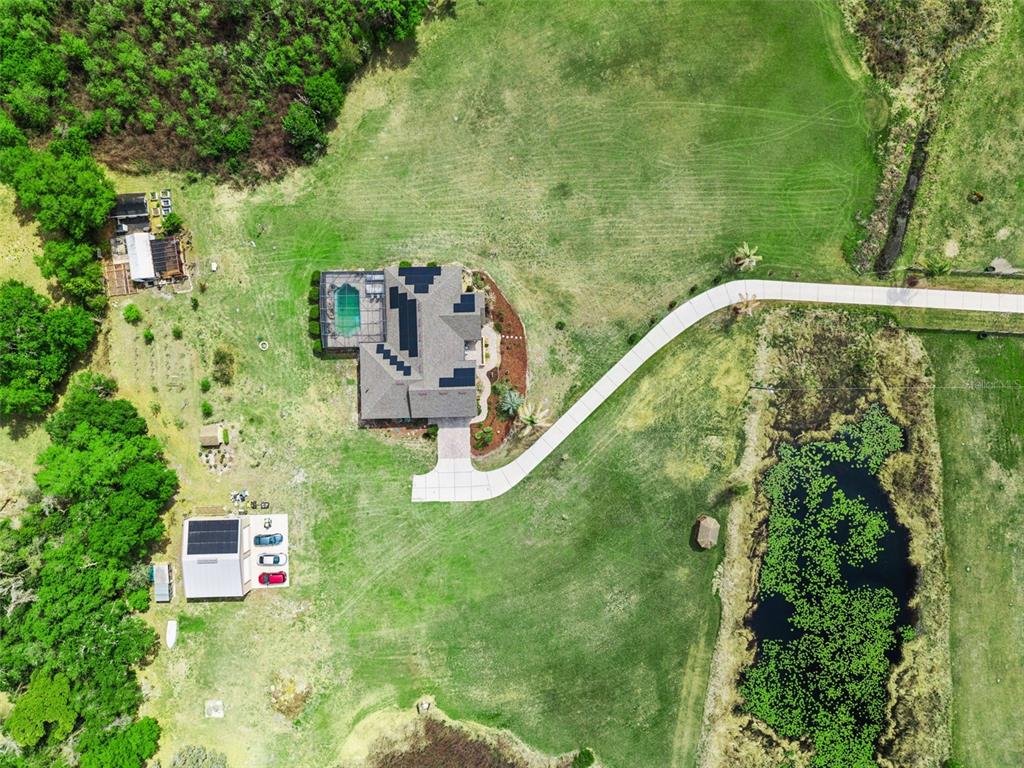 7139 Groveland Farms Road Groveland, FL 34736 - Photo 33 of 36 an aerial view of residential house with outdoor space and trees around