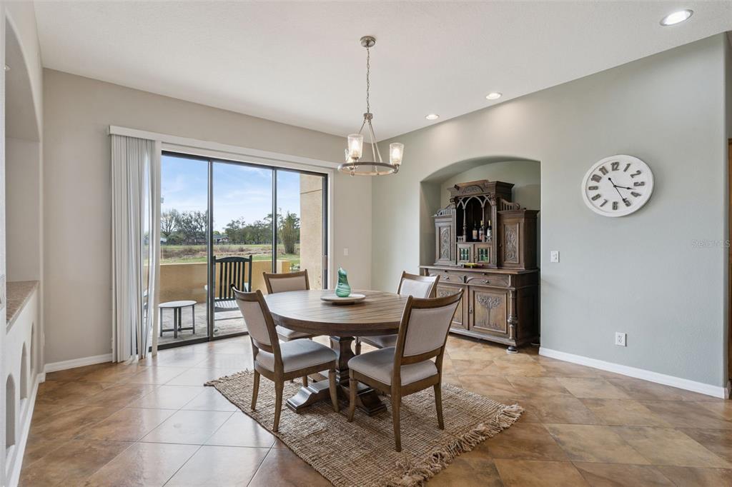 7139 Groveland Farms Road Groveland, FL 34736 - Photo 10 of 36 a view of a dining room and livingroom with furniture window and wooden floor