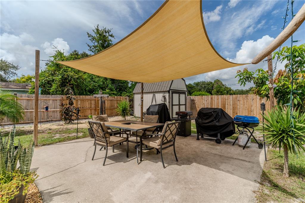 147 Hayes Street Lake Wales, FL 33859 - Photo 17 of 31 a view of backyard with swimming pool and sitting area