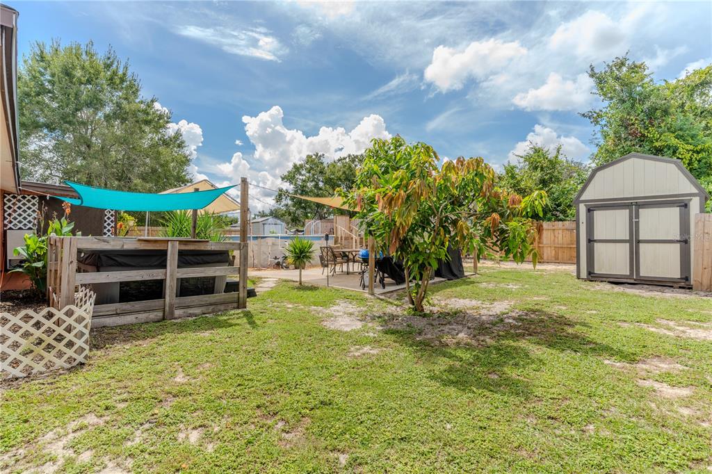 147 Hayes Street Lake Wales, FL 33859 - Photo 18 of 31 a view of a house with a yard and potted plants