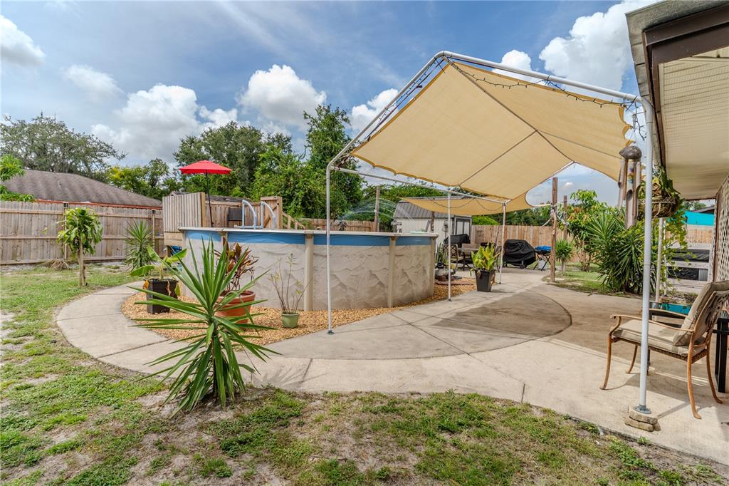 147 Hayes Street Lake Wales, FL 33859 - Photo 30 of 31 a balcony with table and chairs