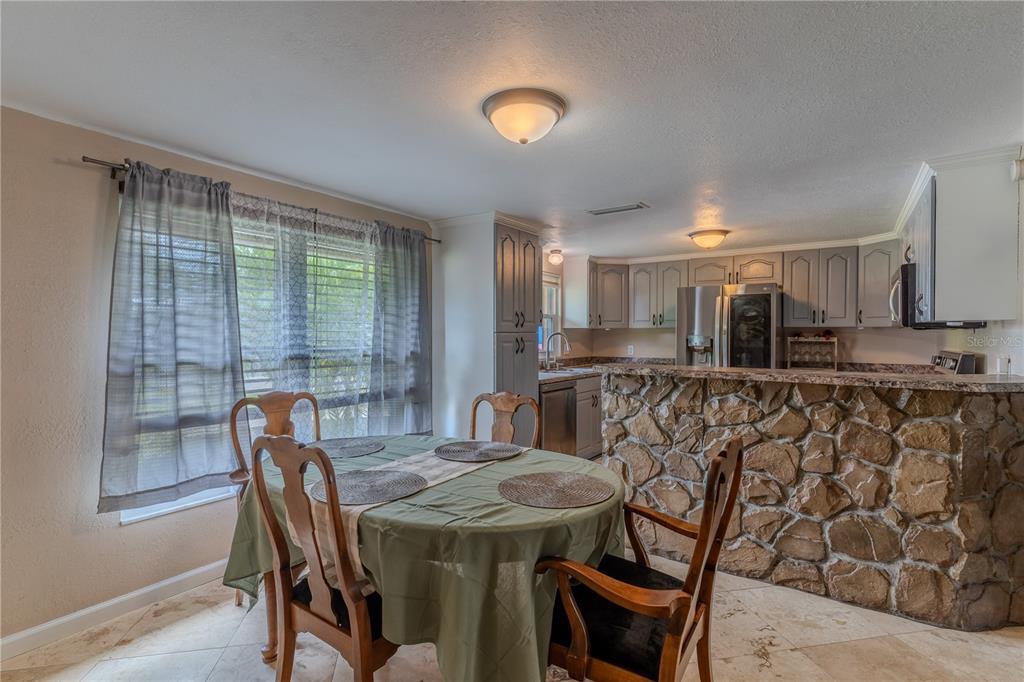 147 Hayes Street Lake Wales, FL 33859 - Photo 7 of 31 a view of a dining room with furniture and window