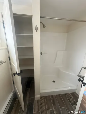 a bathroom with a tub and a shower