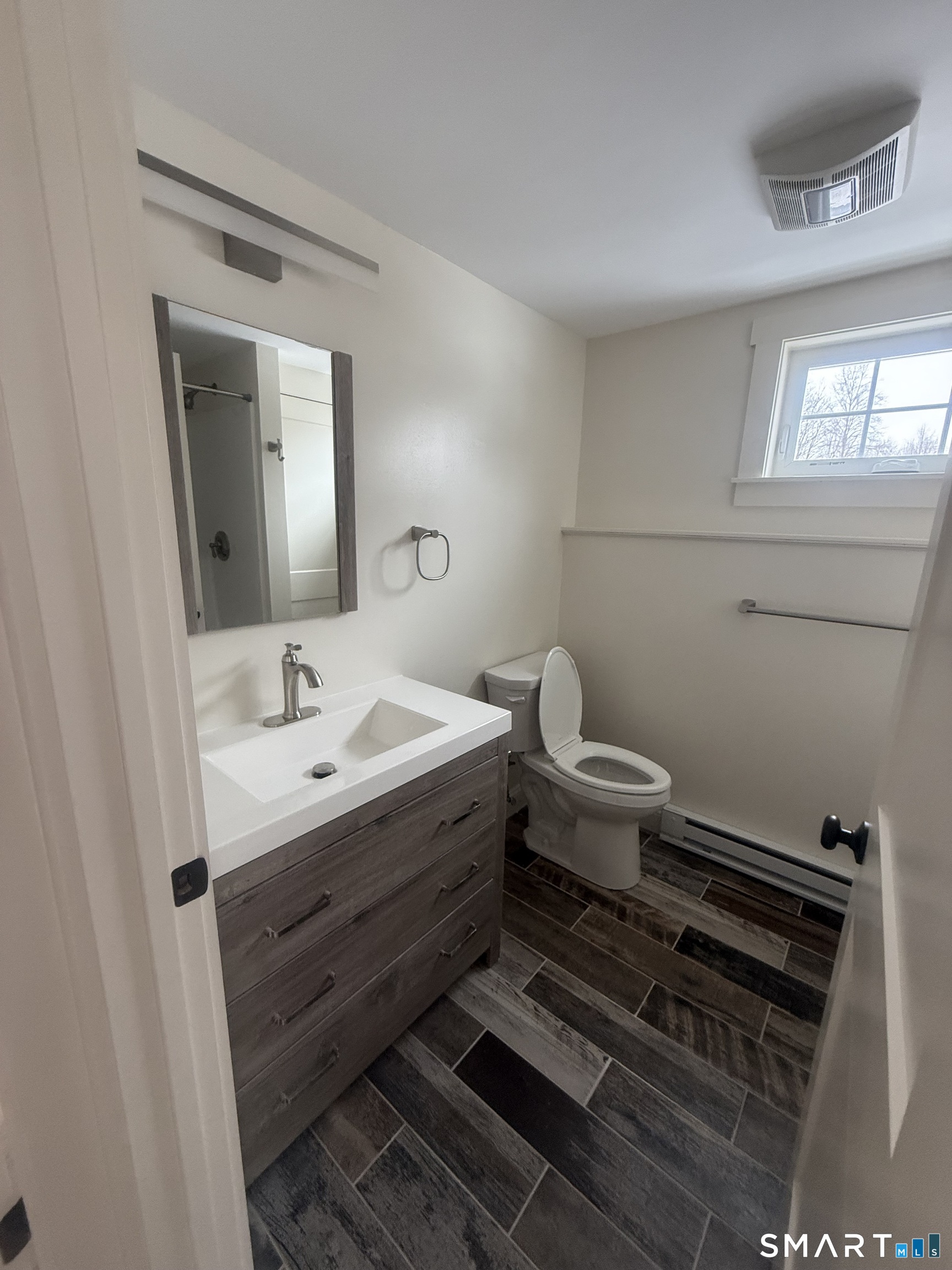 2 Mixville Road Prospect, CT 06410 - Photo 18 of 22 a bathroom with a toilet sink and mirror