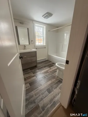 a view of entryway with window and stairs