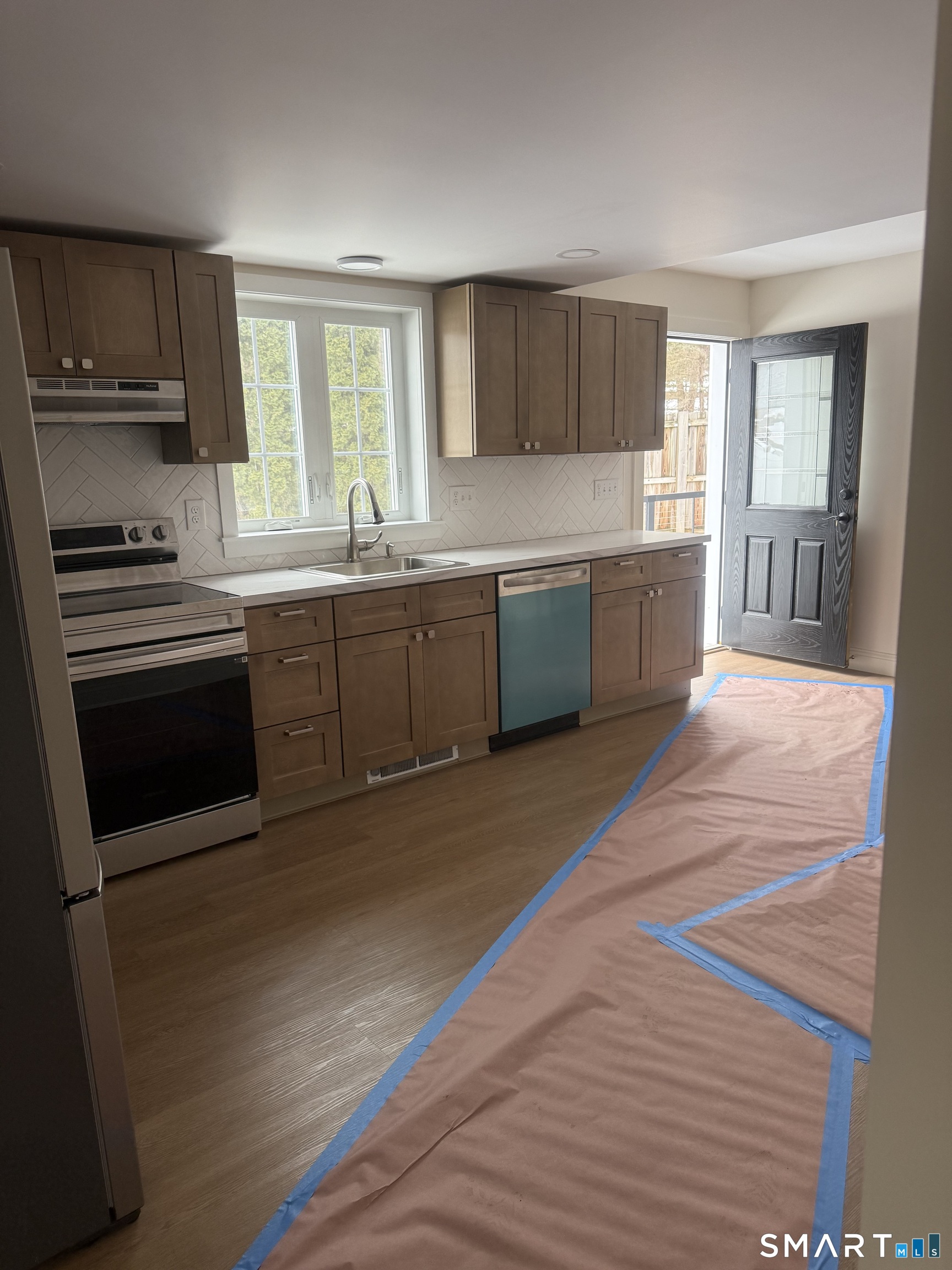 2 Mixville Road Prospect, CT 06410 - Photo 9 of 22 a open kitchen with granite countertop a stove top oven a sink dishwasher and cabinets with wooden floor