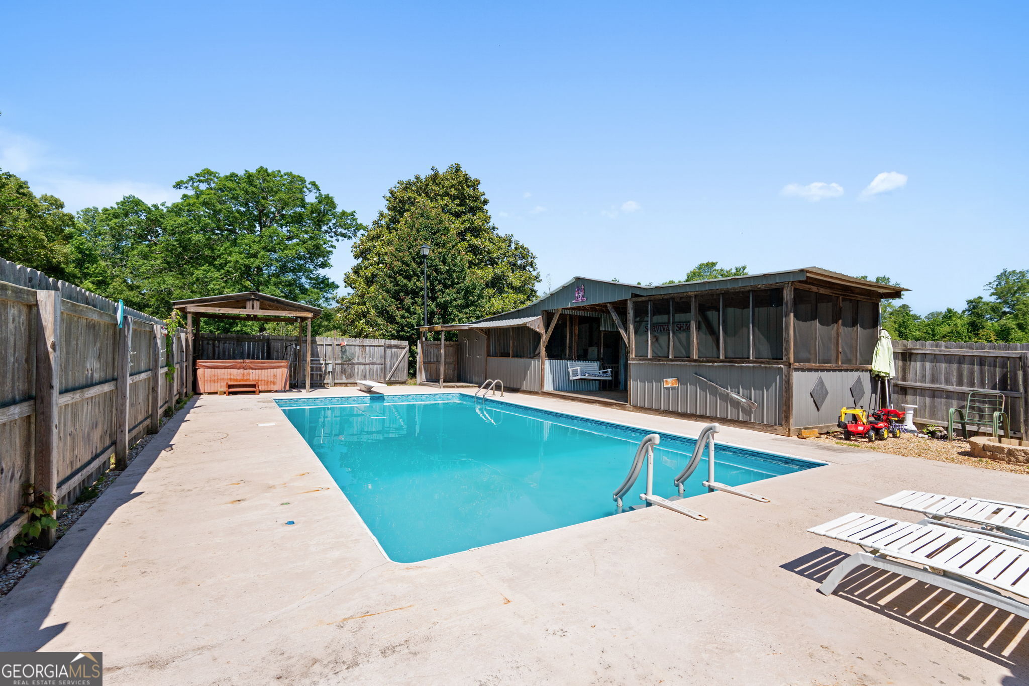 49 Frost Road Bowdon, GA 30108 - Photo 49 of 60 a view of a house with backyard and sitting area