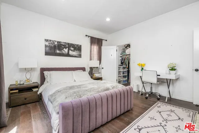 a bedroom with a bed and a table