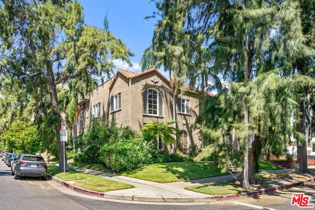 a view of a car park in front of a house