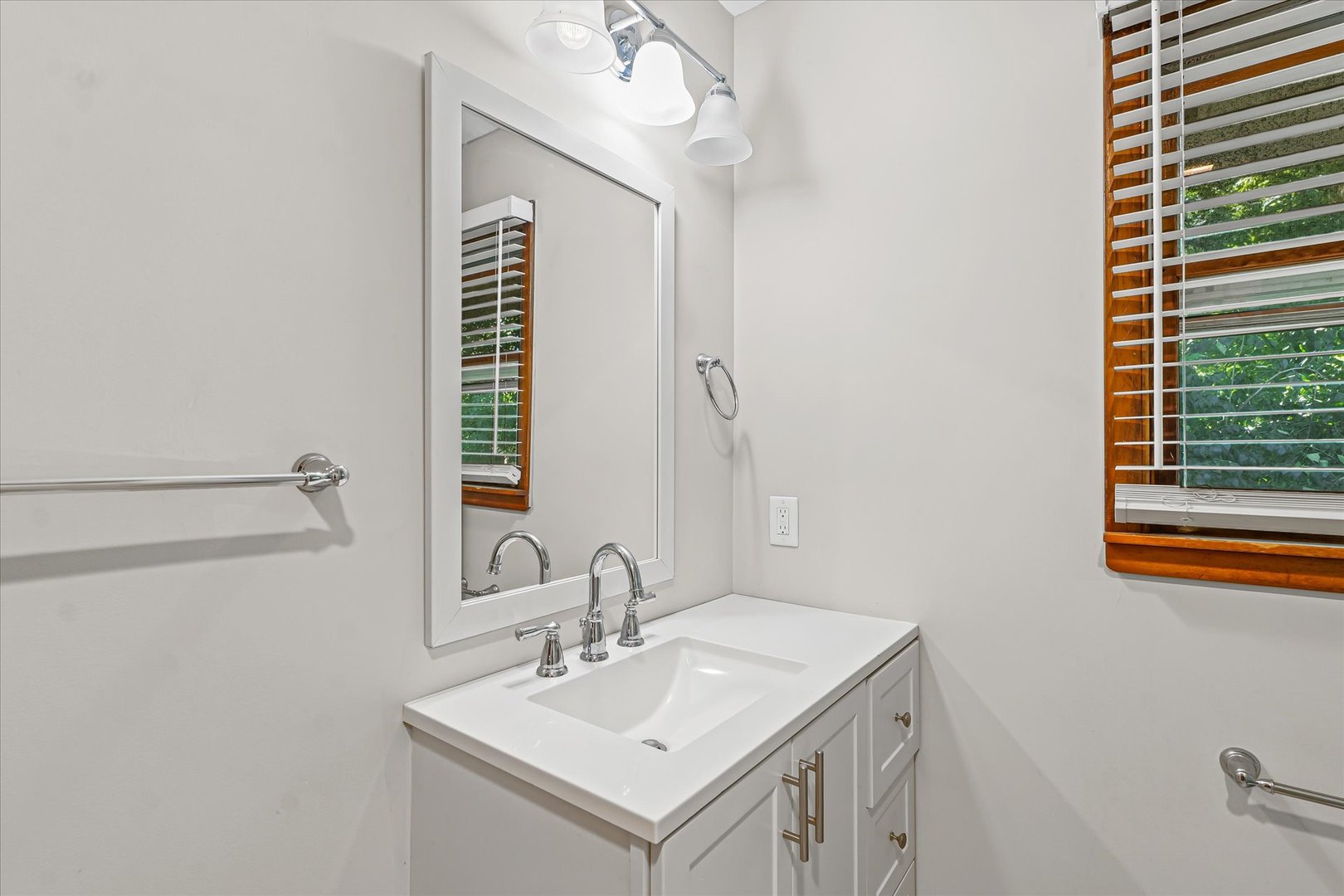 1507 West Columbia Avenue Champaign, IL 61821 - Photo 23 of 28 a bathroom with a sink and a mirror