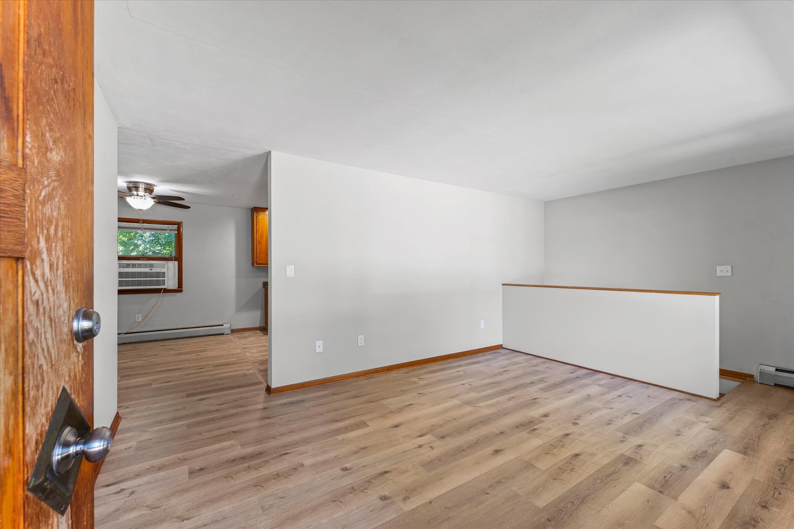1507 West Columbia Avenue Champaign, IL 61821 - Photo 5 of 28 wooden floor in an empty room