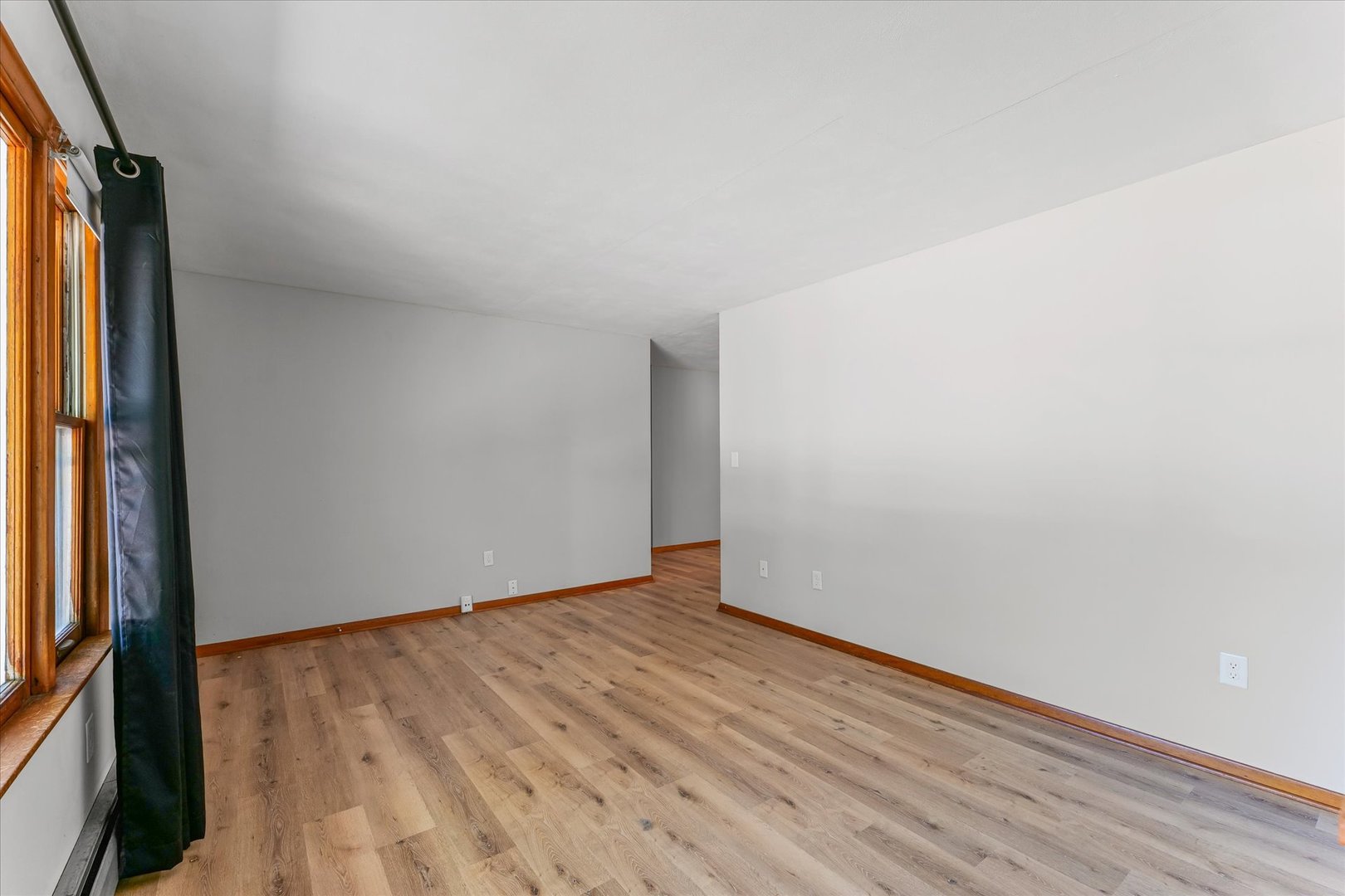 1507 West Columbia Avenue Champaign, IL 61821 - Photo 8 of 28 an empty room with wooden floor and windows
