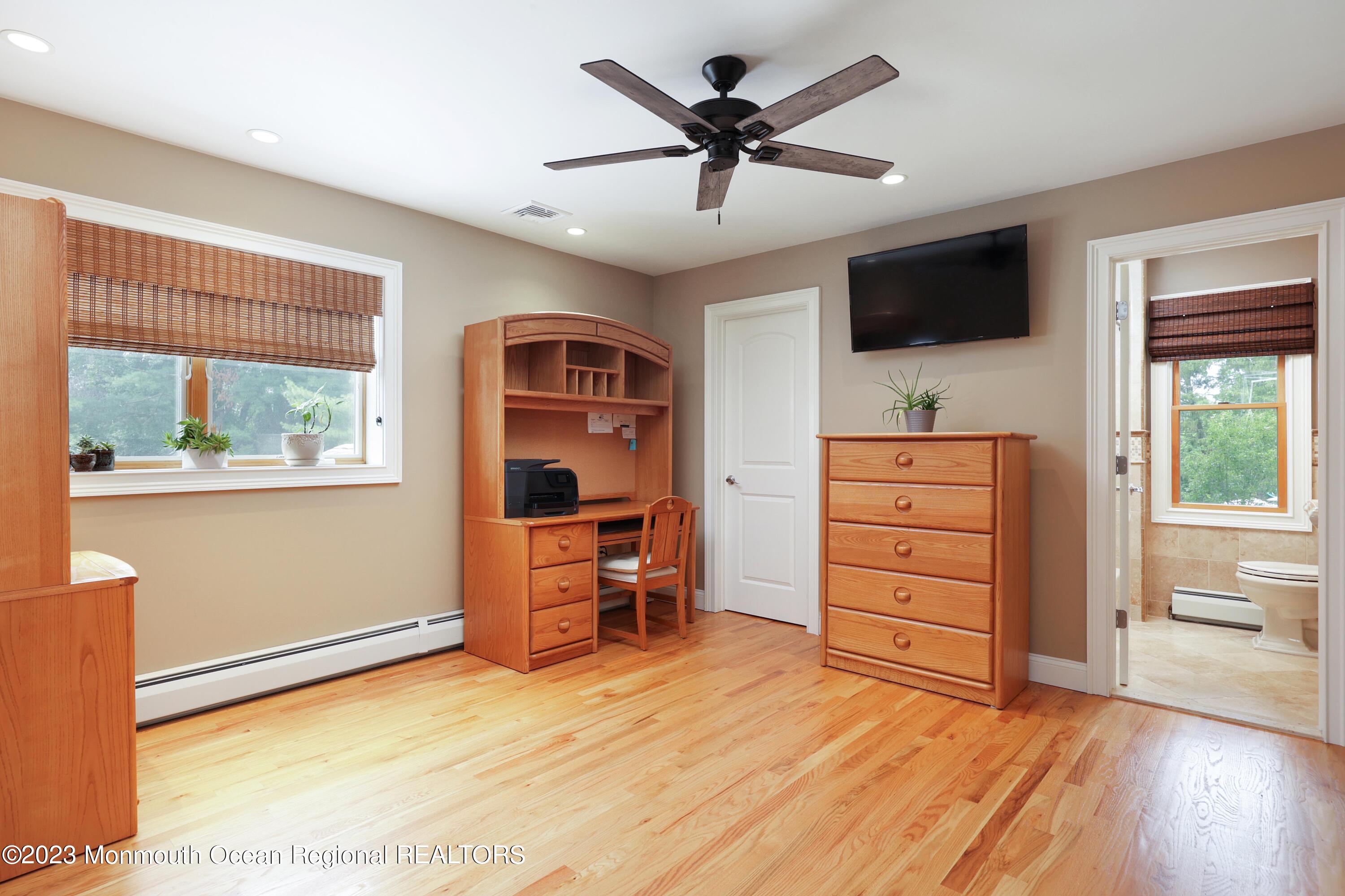 113 Ballantine Road Middletown, NJ 07748 - Photo 12 of 15 a room with furniture and flat screen tv